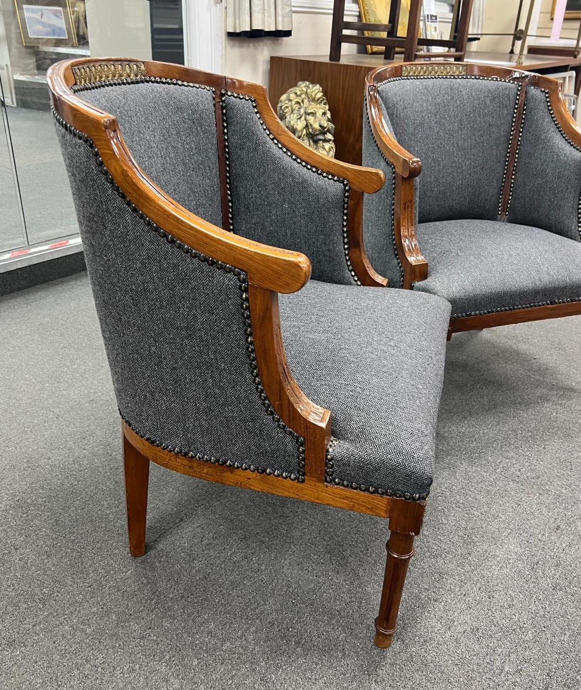 A pair of French Empire style gilt metal mounted upholstered mahogany tub framed chairs, width 62cm, depth 60cm, height 71cm